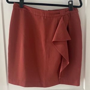 Above knee with side ruffle skirt sz 10